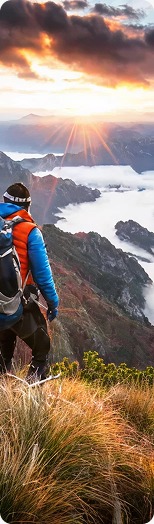 Hiker overlooking mountain sunrise